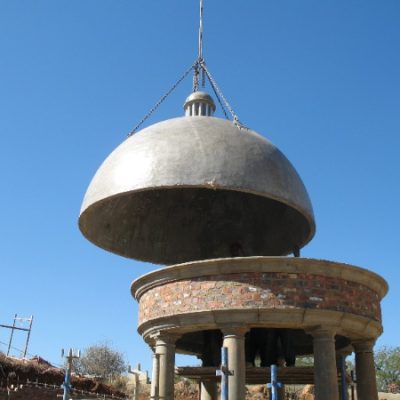 One-piece precast concrete dome manufactured by Gallo Precast, lifted into position on site using a crane as part of a specialist architectural installation.