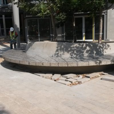 Custom terrazzo concrete bench and integrated planter manufactured and installed by Gallo Precast at Loftus Park Shopping Centre.
